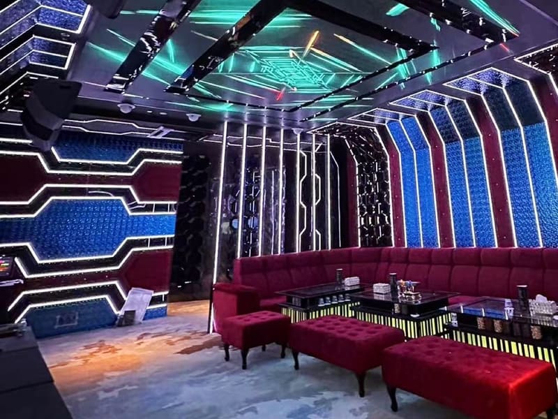 Private KTV room with red sofas and LED walls at Haoman KTV, Prangin Mall, George Town, Penang